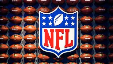 National Football League logo with footballs in background